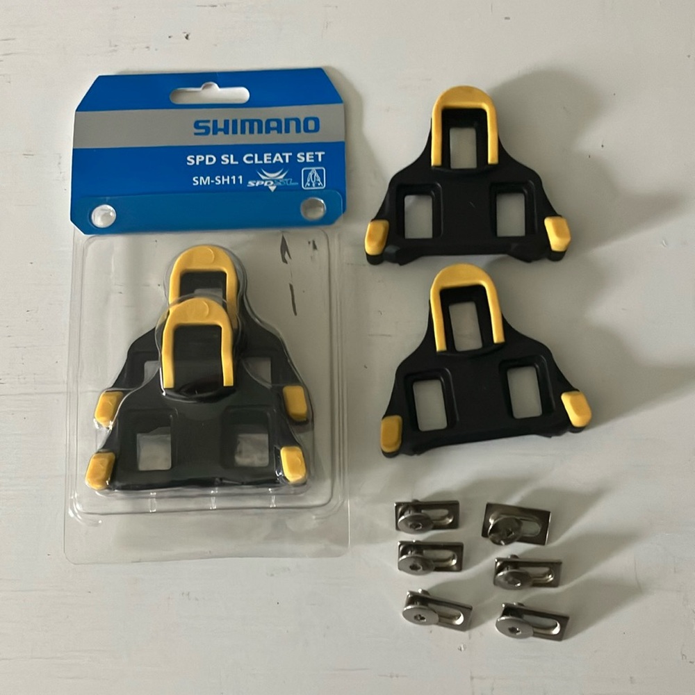 Shimano SM-SH11 Road Cleat Sets (2 pair) with Hardware. 1 pair NWT, 1 pair NWOT.